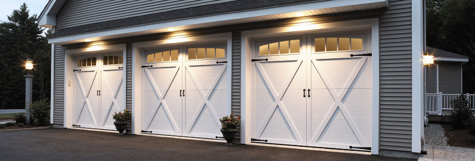 3 single car garages with white doors